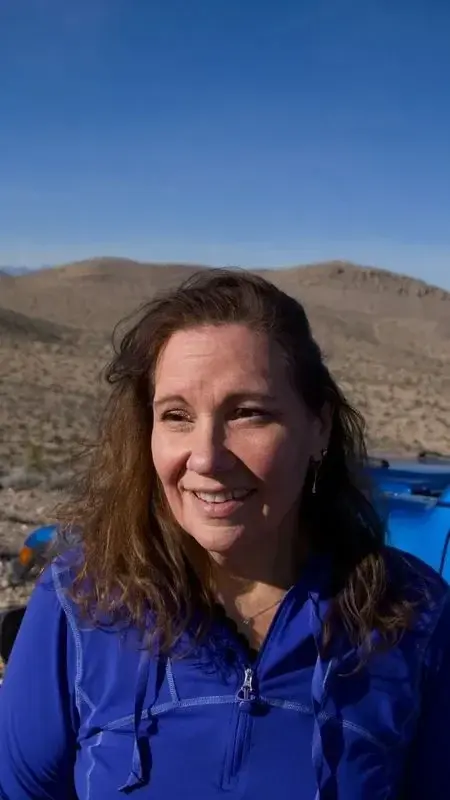 Blue Jeep, desert sun, and a smile made for the trail.
